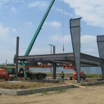 Erecting metal building with a crane